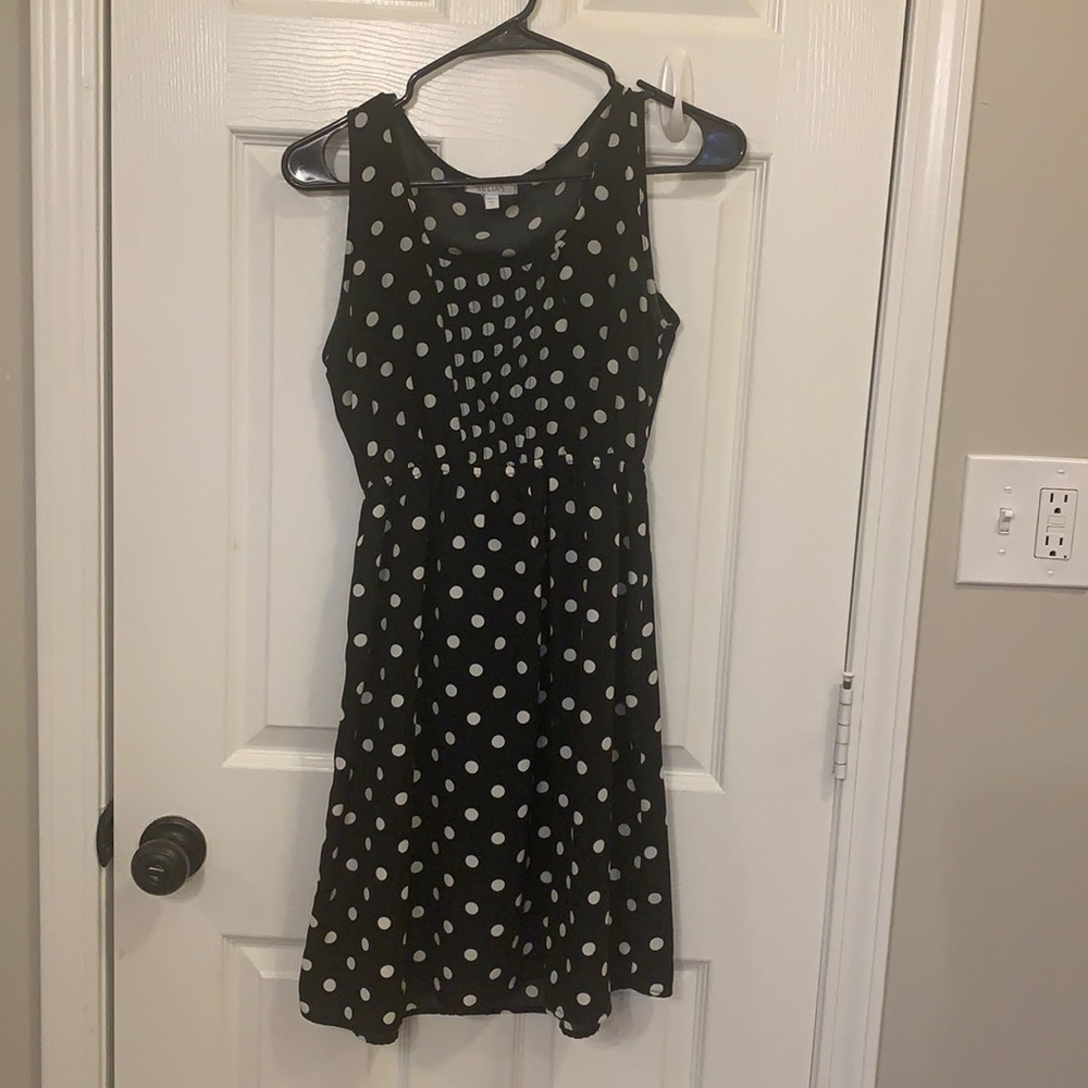 Polka dot black and white dress.